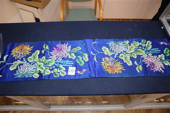 A Chinese silk embroidered hanging and a collection of embroidered sleeve bands and panels